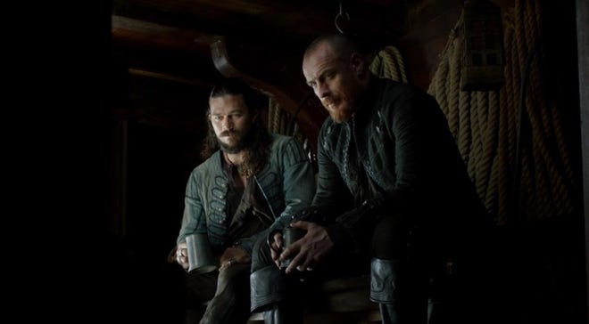 still image from black sails featuring captain flint and john silver
