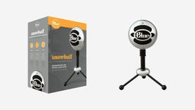 a photo of Blue's Snowball microphone, with a shiny spherical body suspended on three short little metal legs