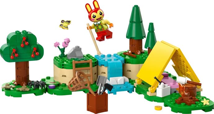Lego-Version von Bunnies Stabhochsprung über einen Fluss.  Es baute ein Zelt auf einem tiefer gelegenen Teil des Geländes auf, während ein Marshmallow über einem Feuer briet.  Eine Kiste mit Werkzeugen wird beiseite gelegt