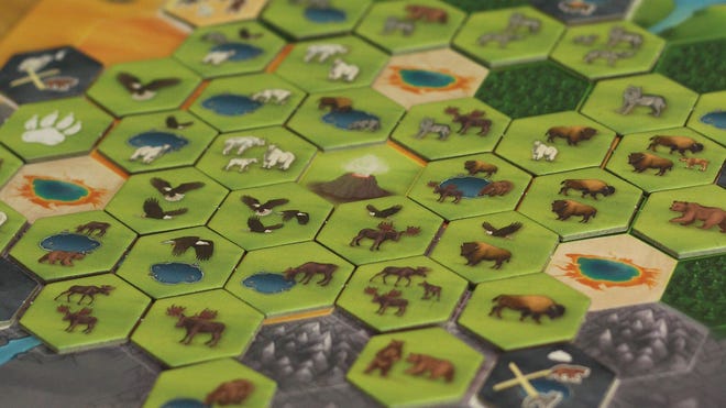 A close-up image of tiles for Caldera board game.
