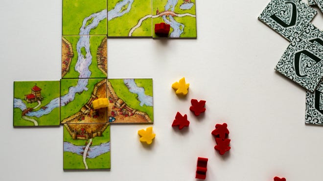 An image of the pieces for Carcassonne.