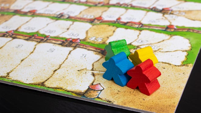 An image of the pieces for Carcassonne.
