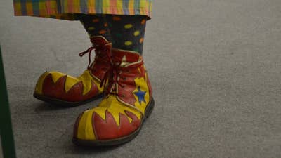 A picture of brightly colored over-sized clown feet