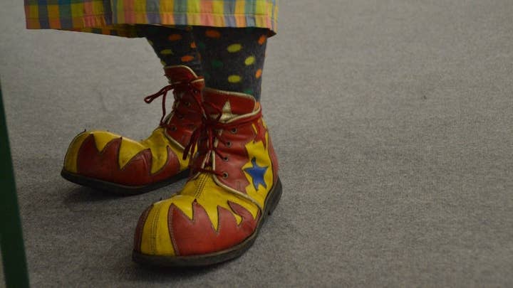 A picture of brightly colored over-sized clown feet