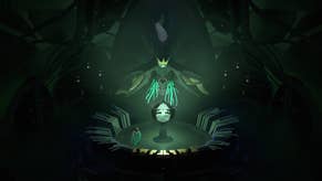 A screenshot of the game Cocoon, showing a largely dark scene that's illuminated in the middle by a glowing green orb of some kind. A little character with insect wings stands nearby.