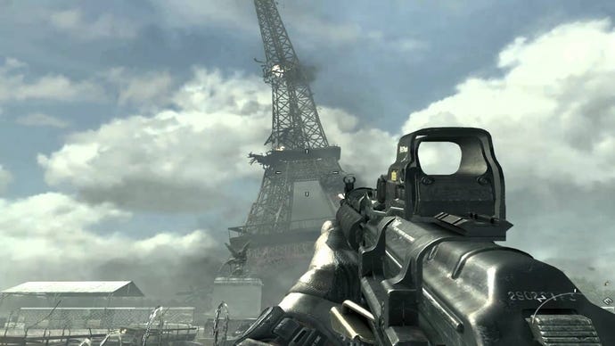 A soldier points a gun at a destroyed Eiffel Tower in Call Of Duty Modern Warfare 3