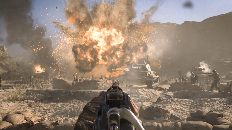The player surveys a desert warzone in Call Of Duty: Vanguard while aiming down sights.