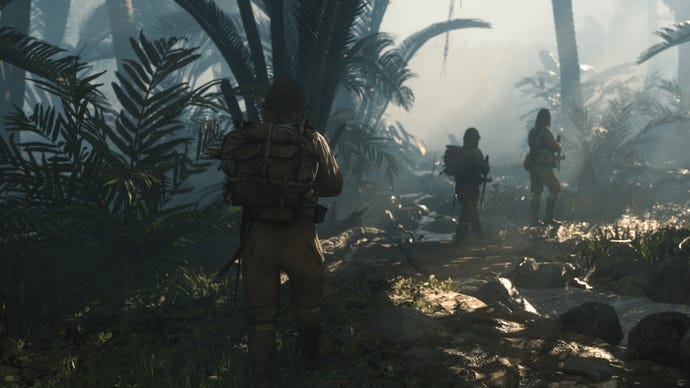 Three soldiers cross a jungle river in Call Of Duty: Vanguard.
