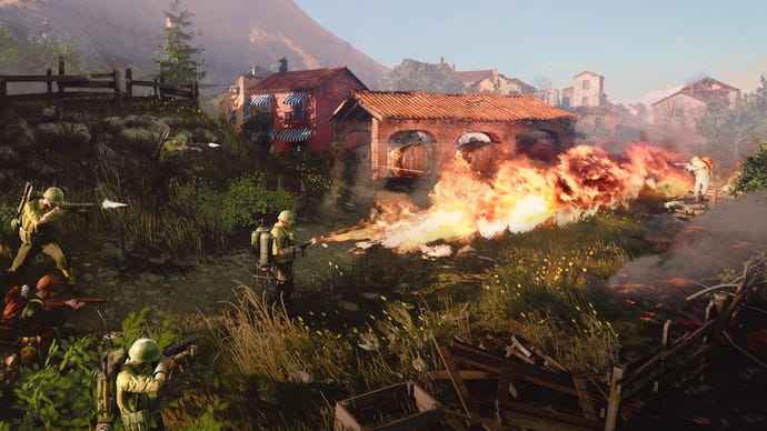 An army man with a flamethrower is burning some very nice rural houses in Company Of Heroes 3.