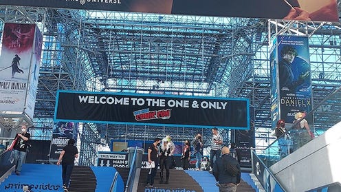 Image of interior of Javits Center with banner welcoming people to NYCC