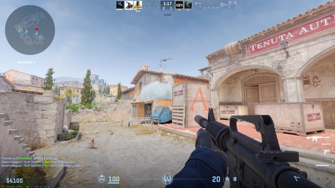 The player points the M4A1-S at a smoke grenade on Inferno in CS2.