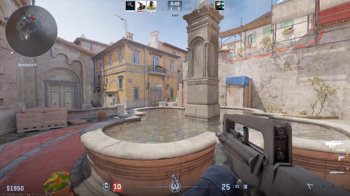 The player aims the FAMAS past a fountain on Inferno in CS2.