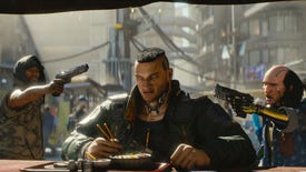 Jackie sits eating his meal at a street vendor in Cyberpunk 2077 while behind him two gang members hold guns to his head.