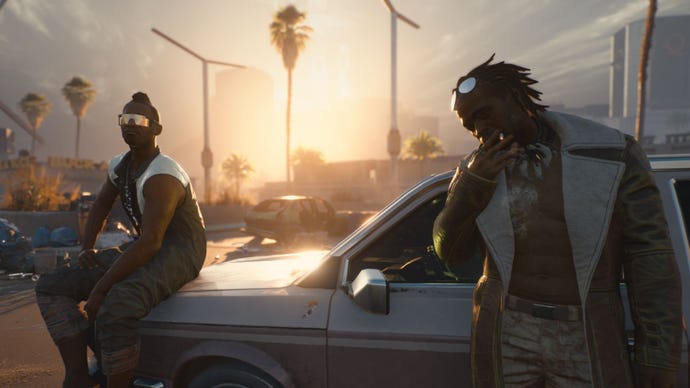 Two characters in Cyberpunk 2077 hanging out around their car. The left character is sitting on the bonnet. The right character is smoking a cigarette.