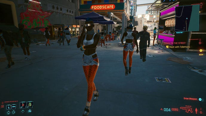 A screenshot of two identical NPCs, both a woman in a blue skirt and orange leopard print leggings, who have just walked past each other on the street in Cyberpunk 2077