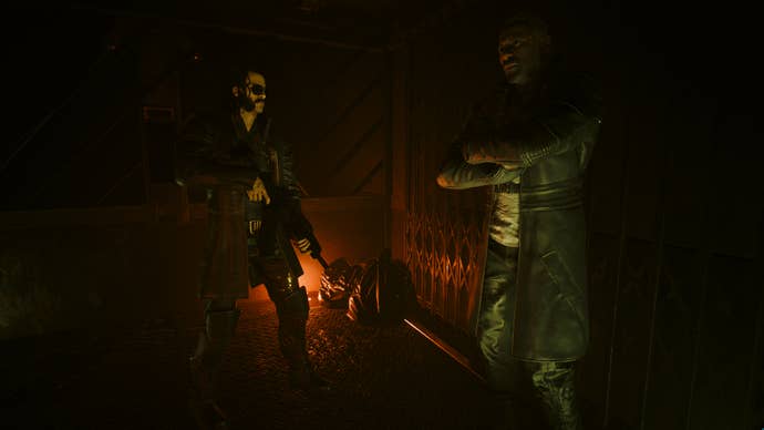 Idris Elba and V ride an elevator in Cyberpunk 2077's Phantom Liberty expansion.