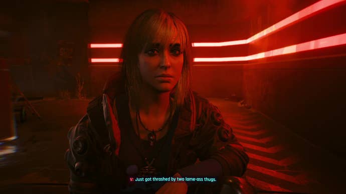 Misty crouches by V in a red-lit alley after they've been mugged, listening sympathetically to their story.