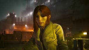 Cyberpunk 2077 relic points locations: A woman with shoulder-length red hair, wearing a light jacket, is depicted against a backdrop of high metal walls, spotlights, and distant fires.