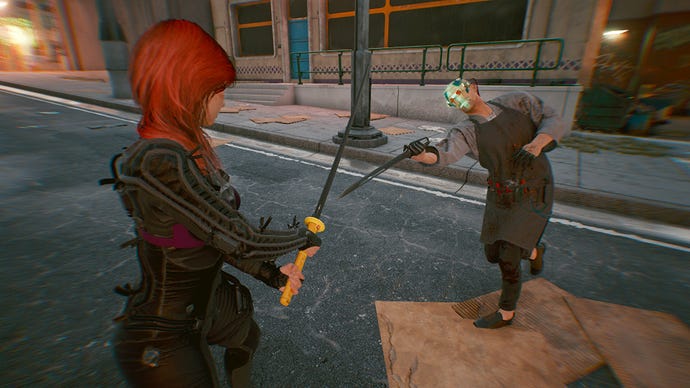 A screenshot of V (left) holding out a katana preparing to block the knife attack from a gang member (right) on the street in Cyberpunk 2077.