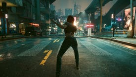 V stands in the middle of a street in Cyberpunk 2077 at night, shooting her gun into the distance. The camera is in third person view behind V.