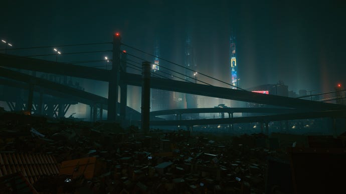 Trash covers the landscape outside Night City in a Cyberpunk 2077 screenshot.