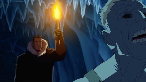 Still image from Batman Doom that Came to Gotham featuring Bruce WAyne holding a torch in an ice cave and a blue eyeless man