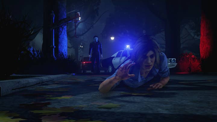 Halloween's Michael Myers approaches a victim crawling away in a promotional shot for Dead By Daylight DLC