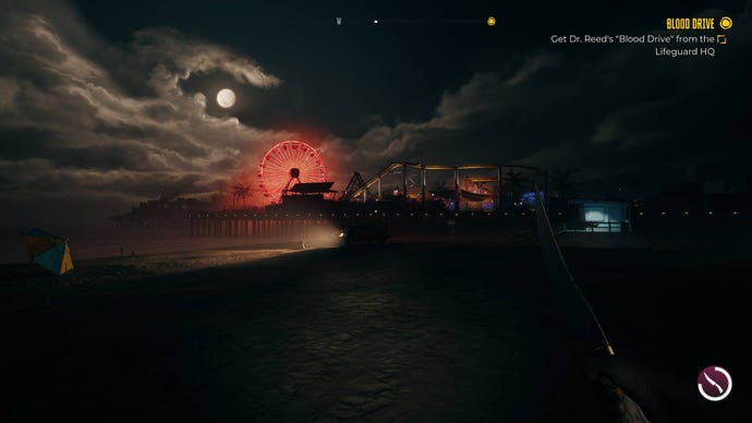 A view of the Santa Monica pier at night, the ferris wheel lit up in red, in Dead Island 2