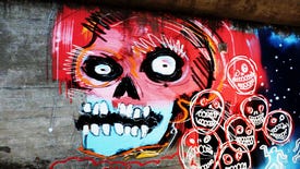 graffiti of a blue and pink zombie skull with staring eyes in an underpass in dead island 2