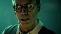 A screenshot from The Devil In Me shows a serious-looking man with a door opening reflected in his glasses