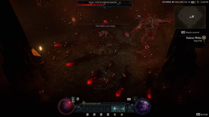 A boss fight against a huge demon creature called X'fal The Scarred Baron in an underground cave in the Diablo 4 beta