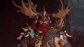 Diablo 4 Tempest Roar: A man with a red beard and a helm with antlers on it is standing near a fire, staring directly into the camera