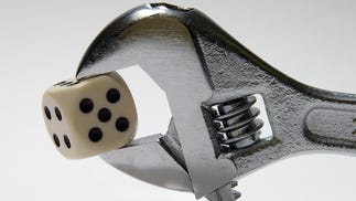 A six-sided dice in a spanner