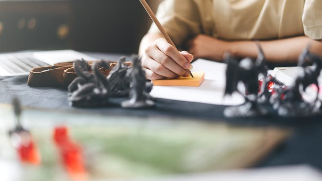 Image of someone playing D&D