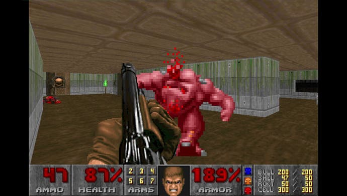An enemy takes a shotgun blast to the head in the shot from Doom.