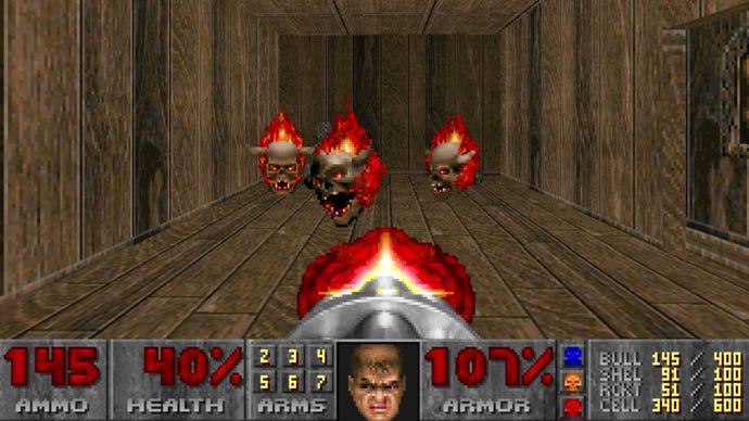 Doom Guy blasts some flaming skulls in Doom (1993)