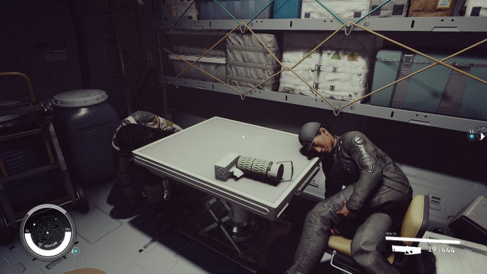 Two dead NPCs in Starfield, slumped over a table.