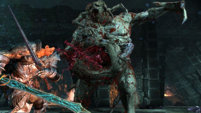 The Grey Warden in Dragon Age: Origins fighting a giant demon