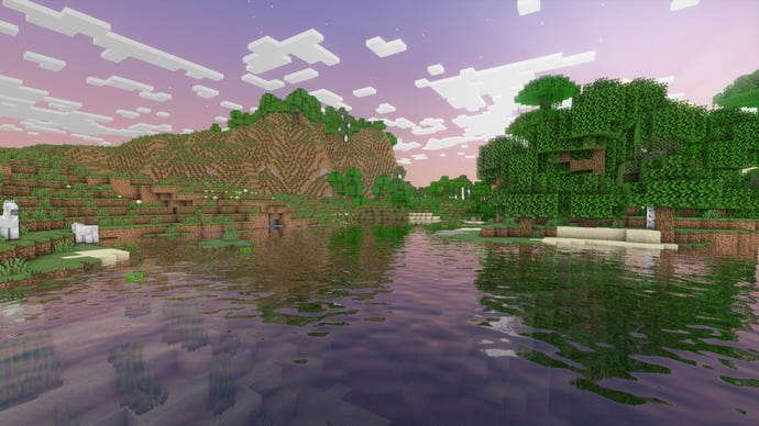 A body of water in front of a hilly forest in Minecraft.