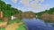 A screenshot of a river in Minecraft, with some trees on either side of the bank and a hill in the distance, taken using DrDesten's shaders.
