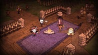 Four Don't Starve Together characters stand by the fire in their constructed base.