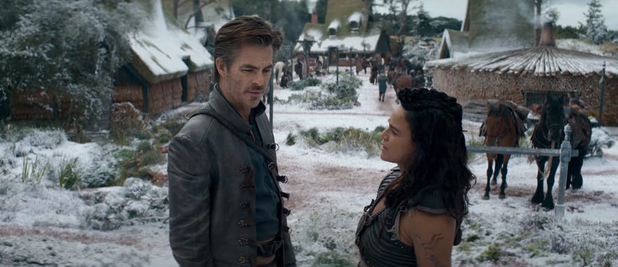 A Still film image featuirng a man and a woman standing in a snowy courtyard in period clothing