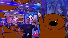 Ed Thorn poses next to a Sonic statue at Gamescom, with Horace the endless bear by his side