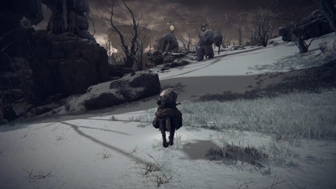 Elden Ring player rides a horse through a snowy field in the Mountaintops of the Giants.