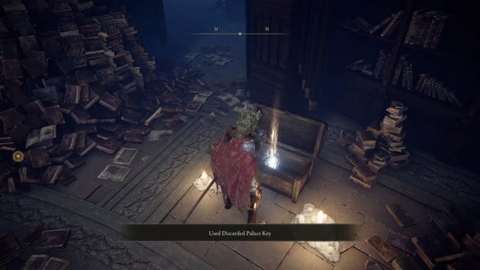 The player in Elden Ring stands in front of the opened chest in Rennala's Academy Library.