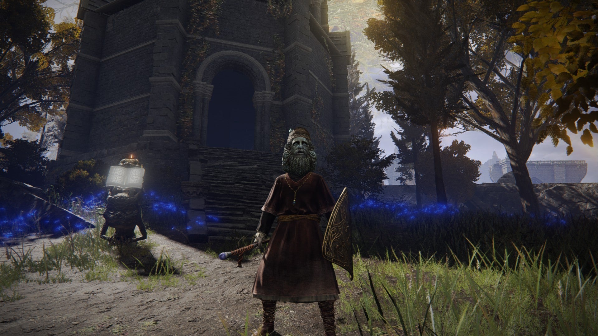 Elden Ring player standing in front of the Testu's Rise tower in the sun