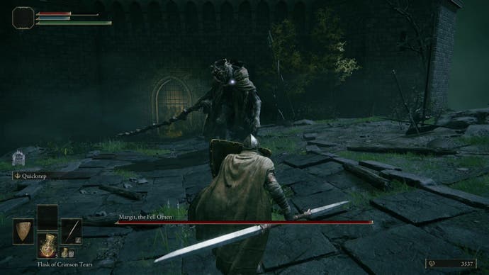 A cloaked character holding a shield up while fighting Margit, The Felled Omen boss in Elden Ring.