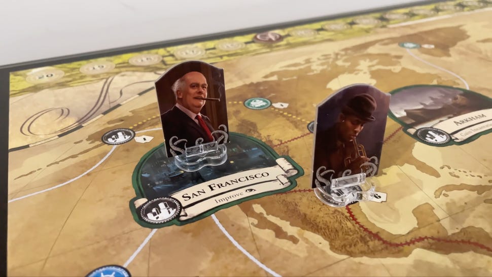 Eldritch Horror board game with character and location tokens