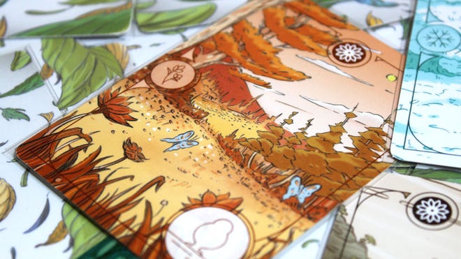 A close-up image of cards from the Evergreen board game