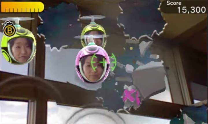 A screenshot of the 3DS Faceraiders AR game shows a handful of floating spherical faces in front of a picture of someone's walls and ceiling. There are a pair of broken wall effects hovering in the air but they are not aligned to the actual environment pictured.